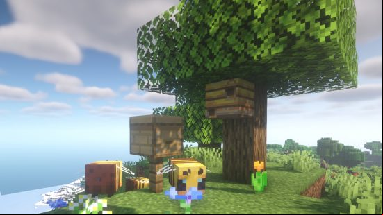 How to get bees in Minecraft: surround a bee nest and a beehive near an oak tree and flowers