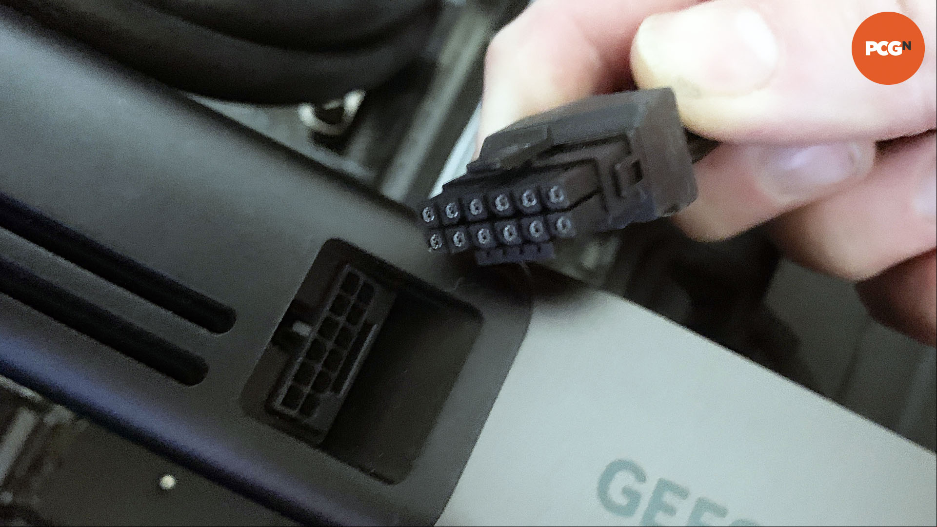 How to install a graphics card: Orientate 16-pin 12VHPWR plug with socket on Nvidia GeForce RTX 5090.
