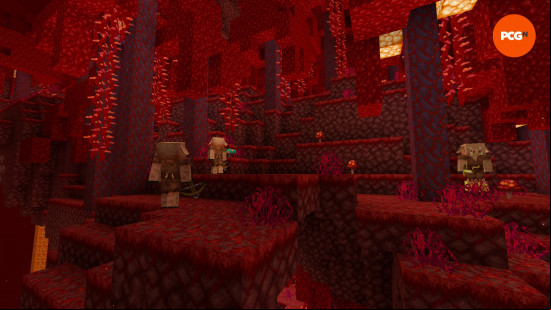 Red trees on a red ground a lit by an orange light as pigmen wander around a Crimson Forest, one of the Nether Minecraft biomes.