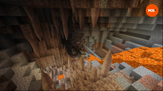 Dripstone stalagmites and stalactites are illuminated by lava in a Dripstone Cave, one of the underground Minecraft biomes.