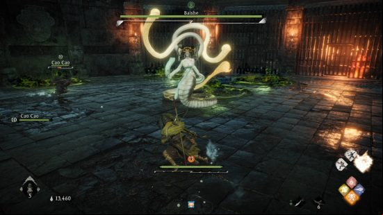 Wo Long bosses - a snake-woman monster known as the Baishe is attacking the player and Cao Cao in a dungeon.