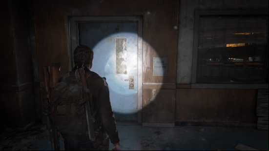 The Last of Us training manuals: a man shines his flashlight on to a wall.