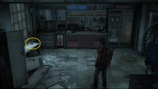 The Last of Us training manuals: a man finds a book on a counter in a dark room.