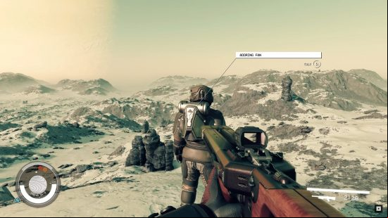The player levels his gun at the Starfield Adoring Fan while his back is turned, too preoccupied with taking in the landscape to notice the threat.