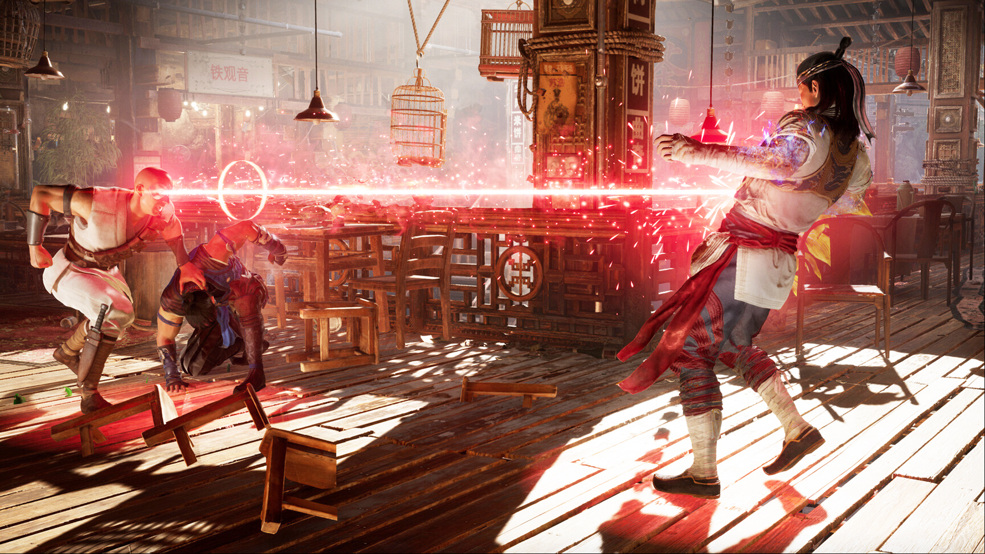 Mortal Kombat 1's Kano, blasting his opponent Liu Kang with his eye-beam.