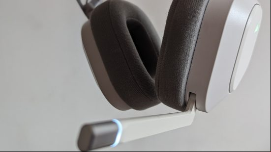 Corsair HS80 Max review: a white headset with extended microphone hovers in front of a white background.