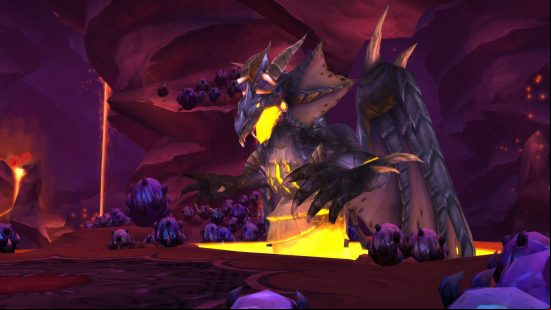A black dragon creature with molten orange lava in its mouth in a cave