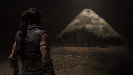 Senua approaches her childhood home, a hut constructed in a traditional Pictish fashion in Hellblade 2.