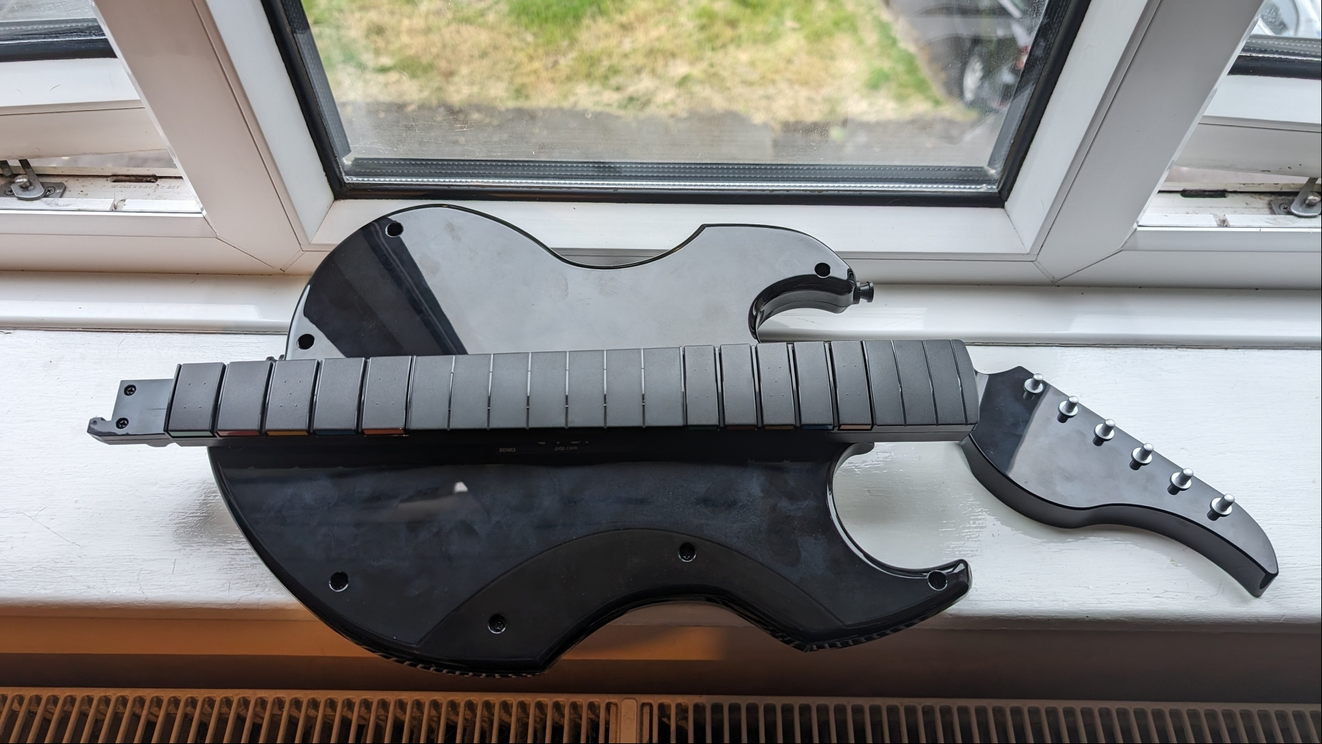 PDP Riffmaster Guitar controller review image showing it folded over and turned upside down.