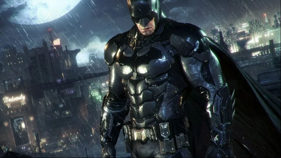 Batman stands in an armored suit in a rainy Gotham.