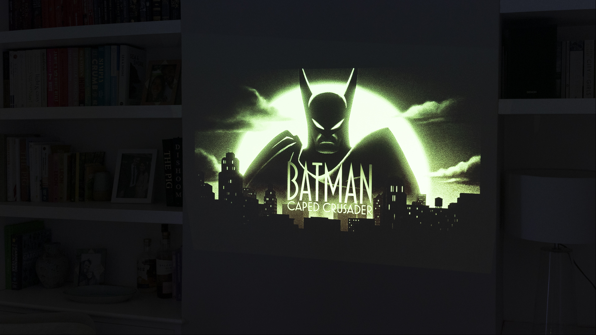 The underneath of the Dangbei Atom laser projector picture showing a Batman animated series