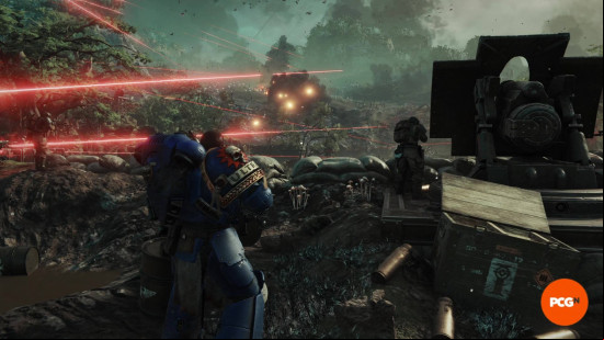Space Marine 2 missions: Titus standing next to sandbags and a cannon as a Tyranid swarm approaches down the hill ahead, with laser fire across the battlefield.