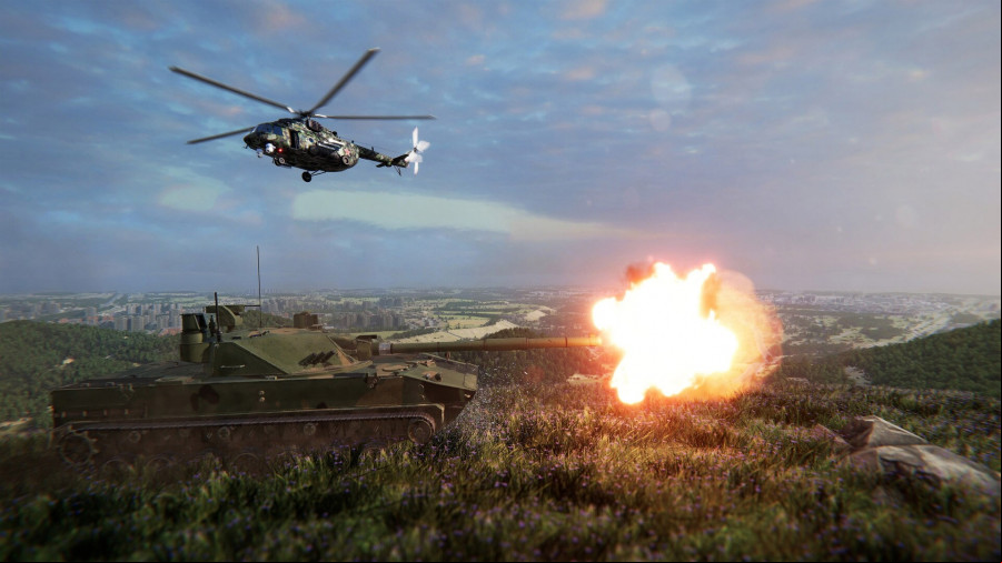 A tank fires with a helicopter flying above.