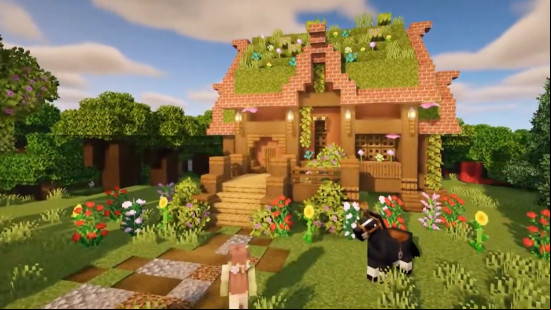 A pretty Minecraft fairy house with a grass-topped roof.