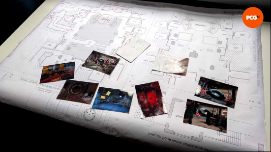 Documents spread across a building blueprint in Den of Wolves.