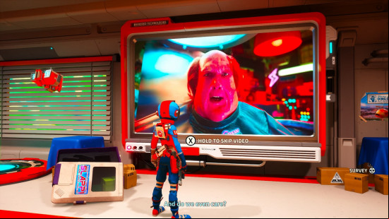 Revenge of the Savage Planet review: Player's character is stood in front of the monitor in their home base in Revenge of the Savage Planet, watching a video of Tweed, the former CEO of Kindred Aerospace.